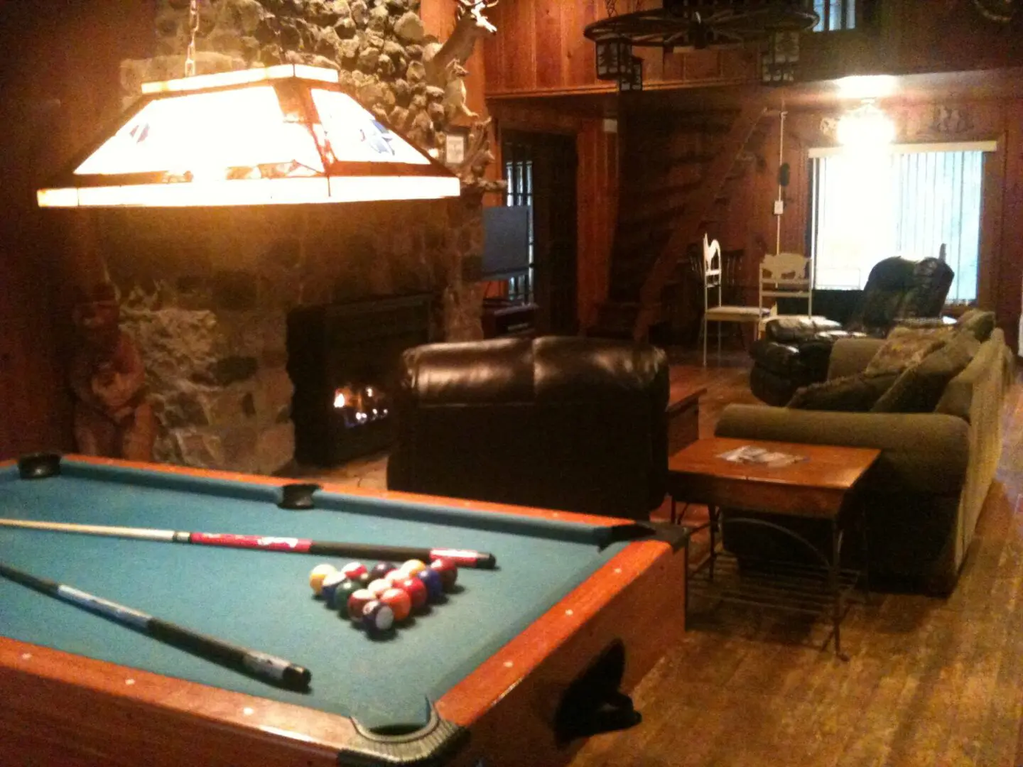 A living area with a pool table